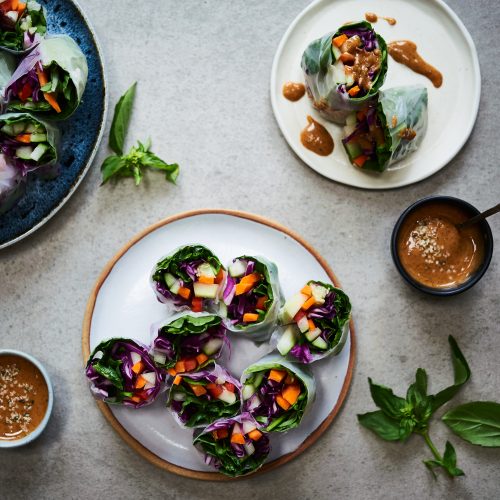 These summer rolls are made with rice wraps and lots of vegetables and herbs with almond butter dipping sauce.